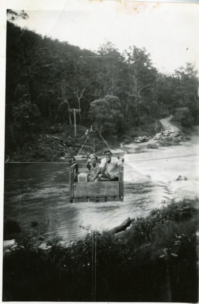 Flying fox at Pine Creek Bridge over the flooded Nerang River, Numinbah Valley, Queensland, circa 1930s Photographer unknown