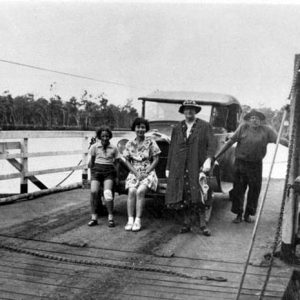 Traugott (Jim) Rachow with passengers on the Alberton Ferry, circa 1940. Photographer unknown.