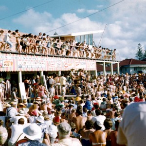 Crowds enjoying entertainment provided at Carnell's Greenmount Beach Kiosk, Coolangatta, Queensland, circa 1960 Photographer unknown