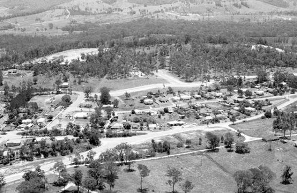 Aerial view over Mudgeeraba township circa 1970s A L Lambert photographer
