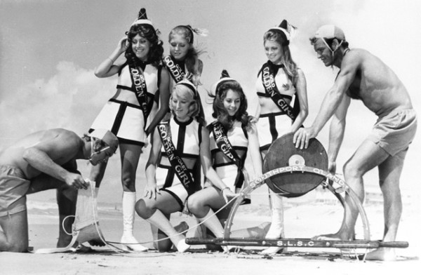 Gold Coast Golden Girls at Main Beach, Queensland with lifesavers and a reel, circa 1970 Len Drummond photographer