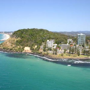 Low aerial from offshore to the headland, Burleigh Heads, Queensland, 2005 Graham Weeks photographer
