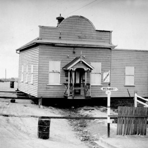 Southport Town Hall, corner of Nerang and Davenport Streets, Southport, Queensland, being moved to make way for construction of a new town hall, circa 1933 George A Jackman, photographer