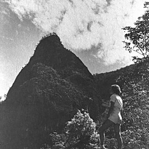 Unidentified woman looking up to Egg Rock in the Numinbah Valley, Queensland, circa 1940s Photographer unknown
