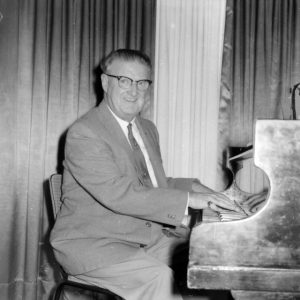 Bob Geraghty playing the piano, circa 1950s. Alexander McRobbie, photographer