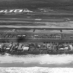 Aerial view over Bilinga and the northern end of the runway, circa 1970s. Photographer unidentified